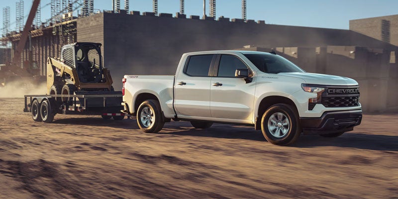 Chevrolet Silverado towing in a work site
